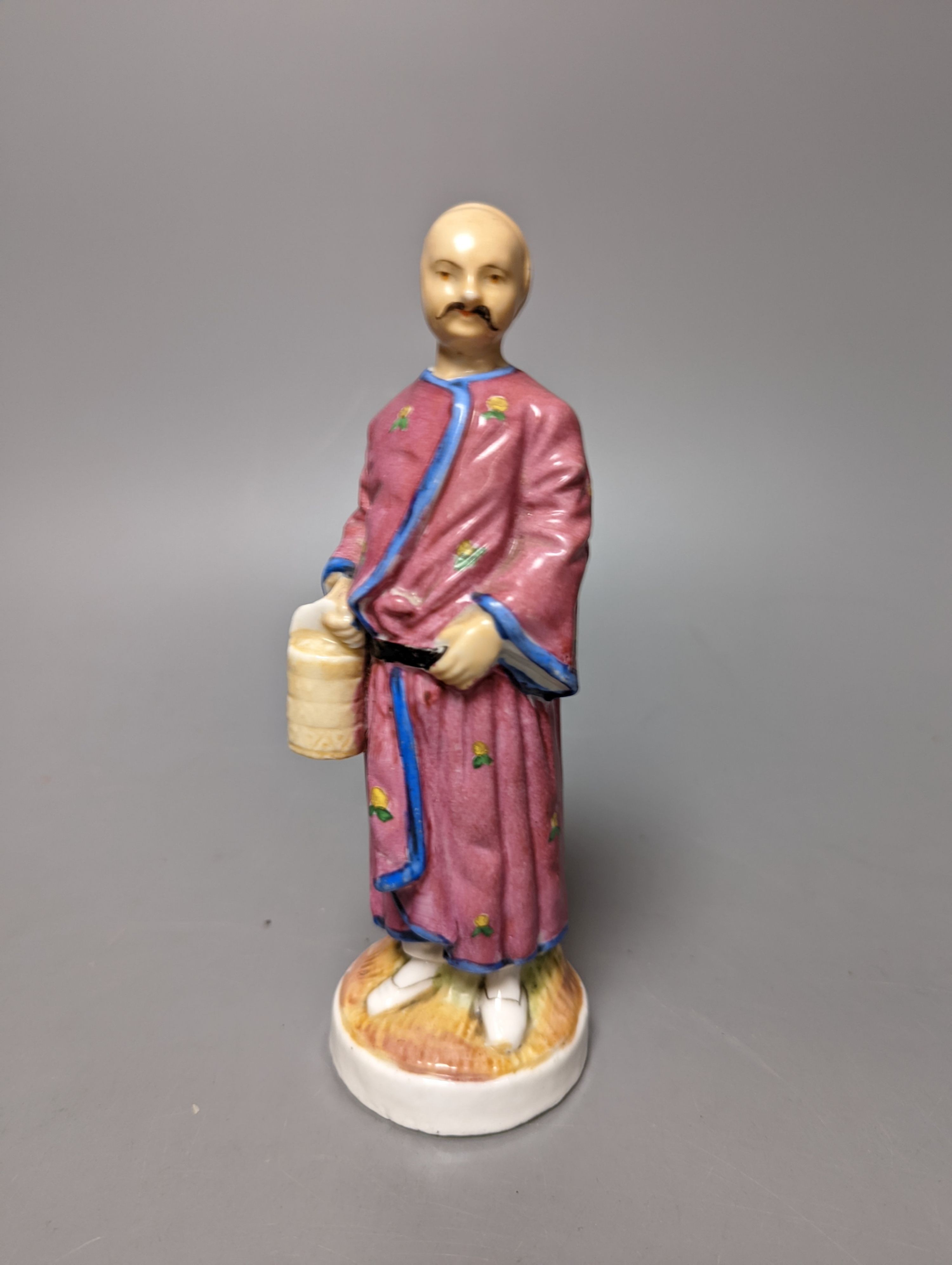 A 19th century French bisque classical female figure, Doulton Imari style teapot and a figure of an SPM porcelain figure of a Chinese man, base marked ‘SPM’. Tallest 34cm